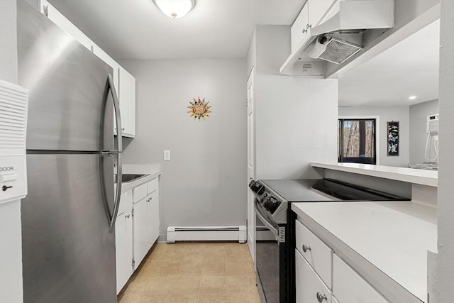 kitchen featuring under cabinet range hood, light countertops, baseboard heating, appliances with stainless steel finishes, and white cabinets