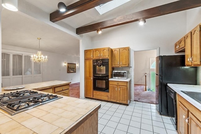 12 Debra Ln, Framingham, MA 01701 - kitchen with black appliances, tile countertops, light tile patterned floors, a chandelier, and decorative light fixtures