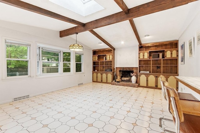 12 Debra Ln, Framingham, MA 01701 - unfurnished living room featuring a skylight, a fireplace, tile patterned floors, and baseboards