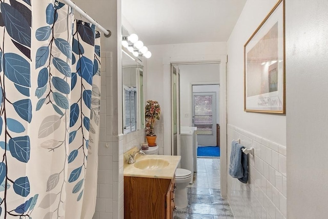 12 Debra Ln, Framingham, MA 01701 - bathroom with toilet, vanity, tile walls, and a shower with shower curtain