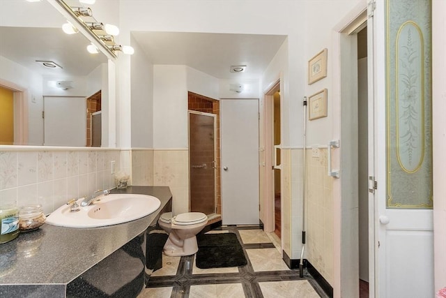 12 Debra Ln, Framingham, MA 01701 - full bath with tile walls, a stall shower, toilet, wainscoting, and vanity