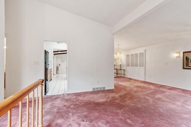 12 Debra Ln, Framingham, MA 01701 - carpeted spare room featuring a chandelier