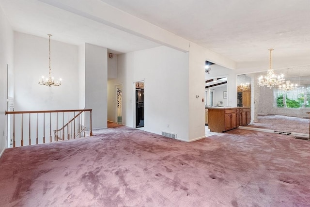 12 Debra Ln, Framingham, MA 01701 - unfurnished room featuring a chandelier, light colored carpet, lofted ceiling, and baseboards