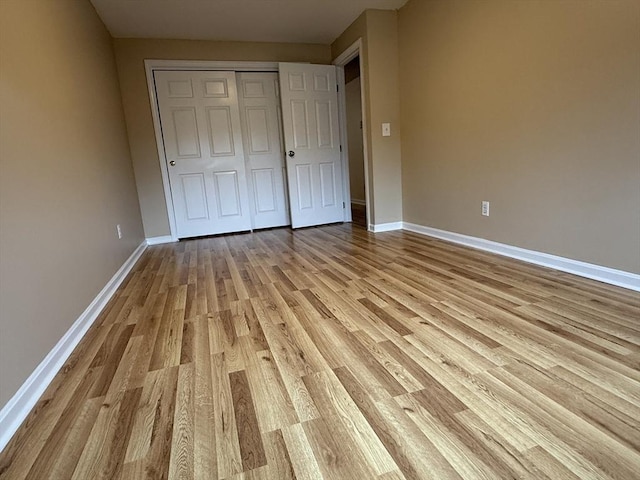 58 Randolph Dr Unit 58, Tewksbury, MA 01876 - unfurnished bedroom with light wood-style flooring and a closet