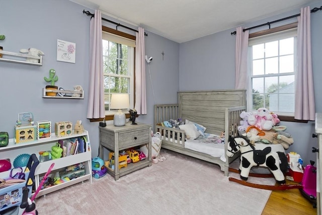 bedroom with wood finished floors