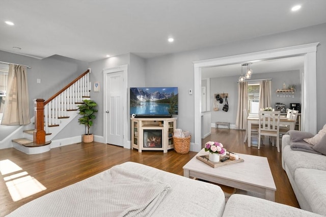 20-A Franklin St, Peabody, MA 01960 - living area with wood finished floors, stairs, and recessed lighting