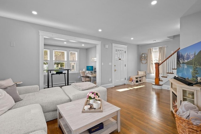 20-A Franklin St, Peabody, MA 01960 - living area with recessed lighting, dark wood-style flooring, stairs, and a baseboard heating unit