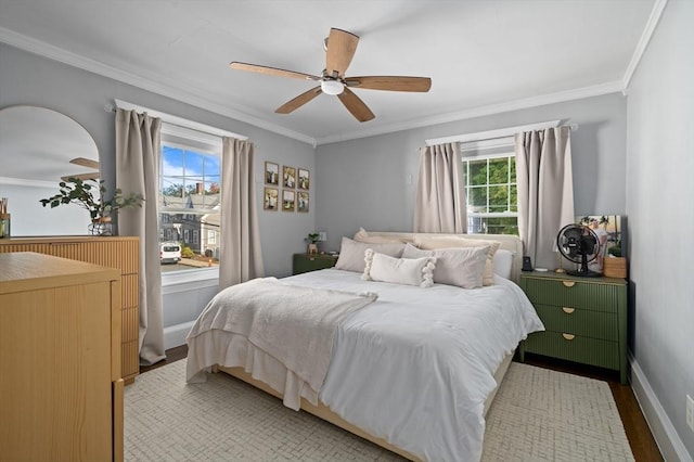 20-A Franklin St, Peabody, MA 01960 - bedroom featuring multiple windows, ornamental molding, wood finished floors, and a ceiling fan