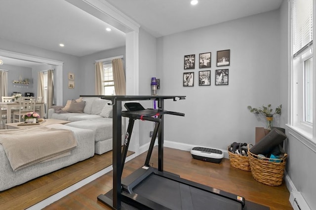 20-A Franklin St, Peabody, MA 01960 - workout area featuring wood finished floors, recessed lighting, and a baseboard radiator