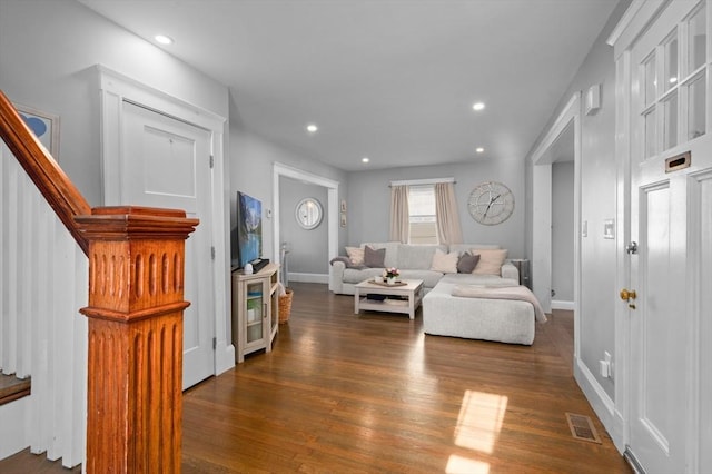 20-A Franklin St, Peabody, MA 01960 - living room with dark wood finished floors, stairs, and recessed lighting