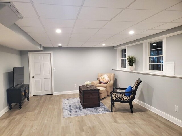 6 Cedar Creek Dr, Attleboro, MA 02703 - sitting room with baseboards, a wood stove, recessed lighting, and wood finished floors