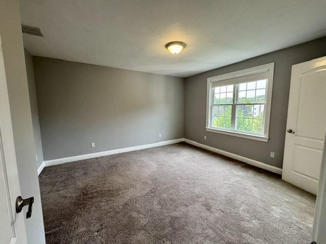 6 Cedar Creek Dr, Attleboro, MA 02703 - unfurnished room featuring carpet flooring, baseboards, and visible vents