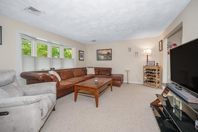 living room featuring baseboards and light colored carpet