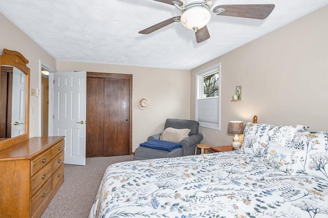 bedroom with carpet flooring, a closet, and ceiling fan