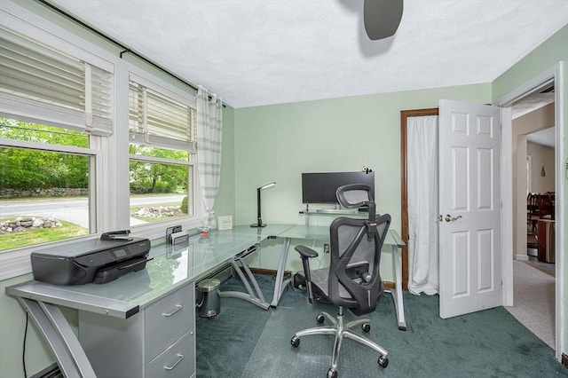 office with ceiling fan and baseboards