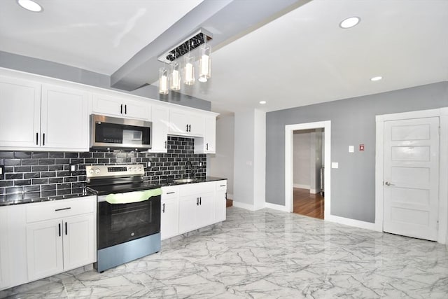 176 N Blvd, West Springfield, MA 01089 - kitchen featuring stainless steel appliances, light marble finish floors, dark countertops, backsplash, and white cabinetry