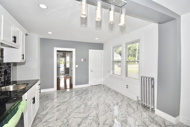 176 N Blvd, West Springfield, MA 01089 - kitchen featuring radiator, healthy amount of natural light, light marble finish flooring, white cabinetry, and recessed lighting