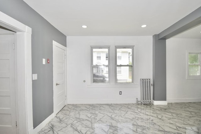 176 N Blvd, West Springfield, MA 01089 - spare room featuring radiator, marble finish floors, and recessed lighting
