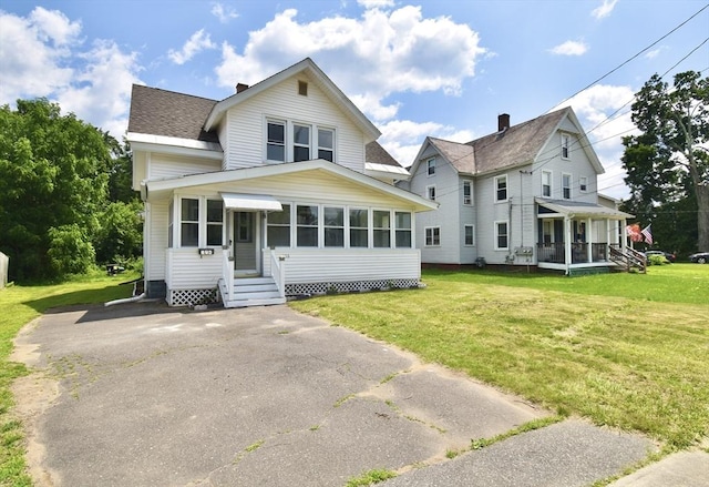 176 N Blvd, West Springfield, MA 01089 - view of front facade with a front yard, entry steps, roof with shingles, and covered porch