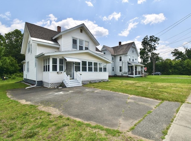 176 N Blvd, West Springfield, MA 01089 - view of front of house featuring a chimney, entry steps, a shingled roof, and a front yard