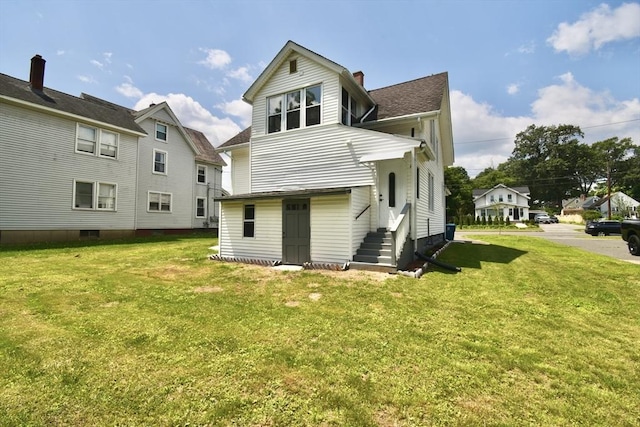 176 N Blvd, West Springfield, MA 01089 - rear view of property with entry steps, a yard, and a chimney