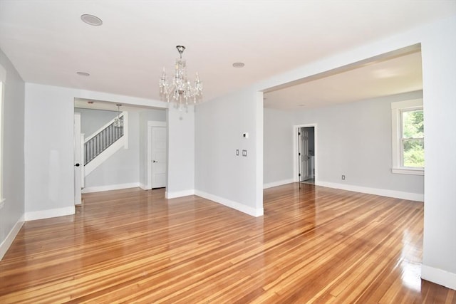 176 N Blvd, West Springfield, MA 01089 - empty room featuring stairs, a chandelier, and light wood-type flooring