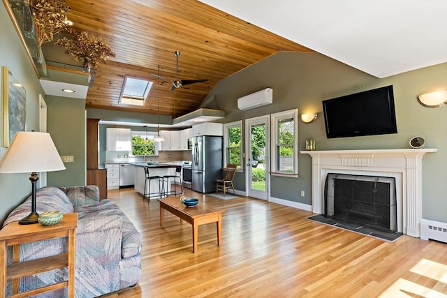living room with a wall mounted AC, wooden ceiling, light wood-style flooring, healthy amount of natural light, and high vaulted ceiling