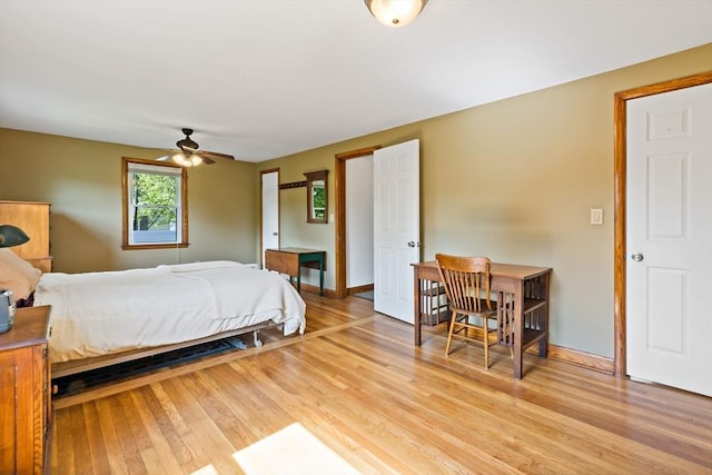 bedroom featuring light wood-type flooring and baseboards