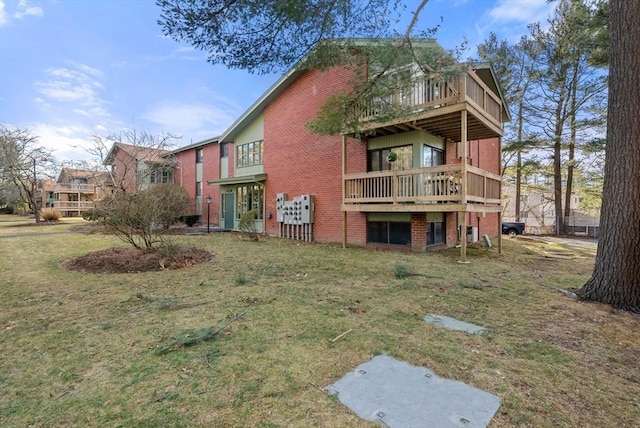 exterior space with a lawn and brick siding