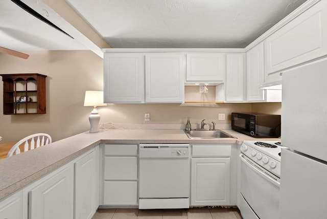 kitchen with white appliances, light tile patterned flooring, a sink, light countertops, and white cabinetry