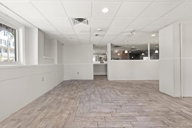 unfurnished room featuring a drop ceiling and recessed lighting