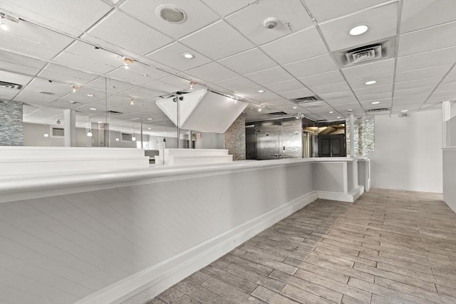 surrounding community featuring recessed lighting and a paneled ceiling