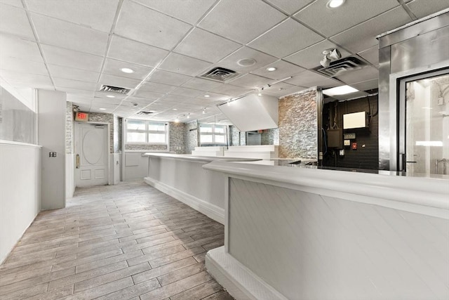 reception area featuring a paneled ceiling