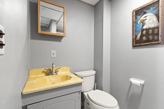 bathroom featuring toilet and vanity