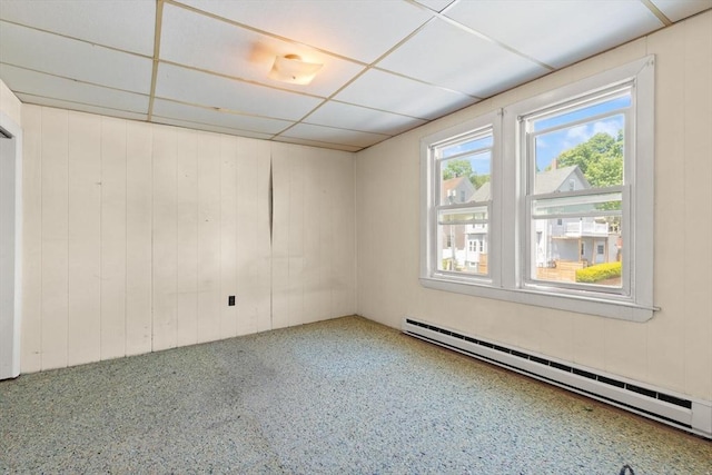 empty room featuring a baseboard heating unit