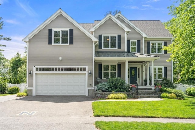 16 Winfield St, Needham, MA 02492 - traditional home featuring driveway, a standing seam roof, an attached garage, a porch, and a metal roof