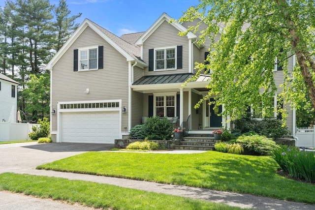16 Winfield St, Needham, MA 02492 - view of front of house featuring an attached garage, a standing seam roof, covered porch, asphalt driveway, and a metal roof
