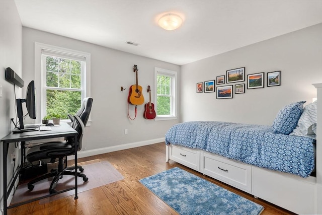 16 Winfield St, Needham, MA 02492 - bedroom with wood finished floors and an office area