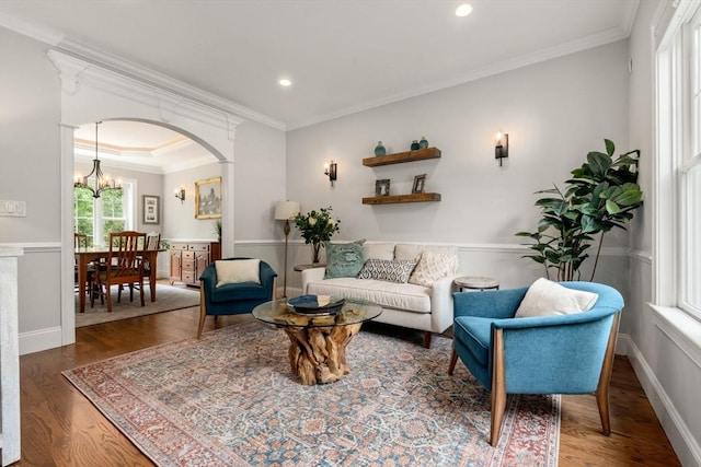 16 Winfield St, Needham, MA 02492 - living area with a chandelier, wood finished floors, arched walkways, crown molding, and recessed lighting