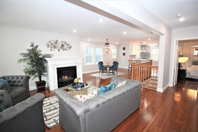 318 Concord Ave Unit 1, Cambridge, MA 02138 - living area with a chandelier, dark wood-type flooring, recessed lighting, and baseboards