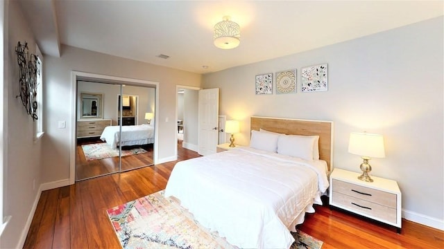 318 Concord Ave Unit 1, Cambridge, MA 02138 - bedroom with wood finished floors, baseboards, and a closet