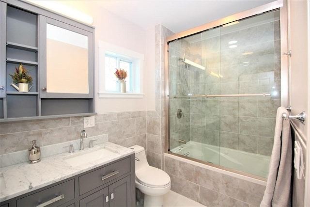 318 Concord Ave Unit 1, Cambridge, MA 02138 - bathroom featuring tiled shower / bath combo, toilet, and vanity