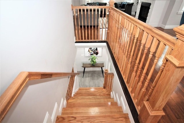 318 Concord Ave Unit 1, Cambridge, MA 02138 - staircase with wood finished floors and baseboards