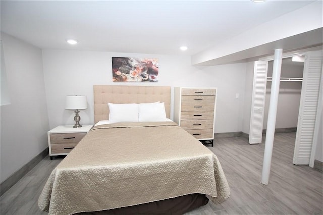 318 Concord Ave Unit 1, Cambridge, MA 02138 - bedroom with baseboards, wood finished floors, recessed lighting, and a closet