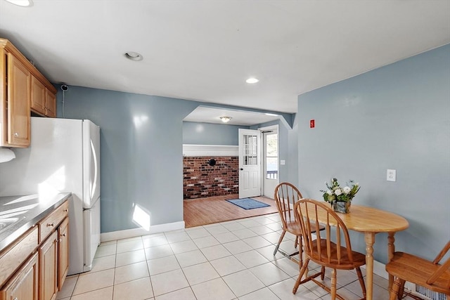 dining space featuring light tile patterned floors, recessed lighting, and baseboards