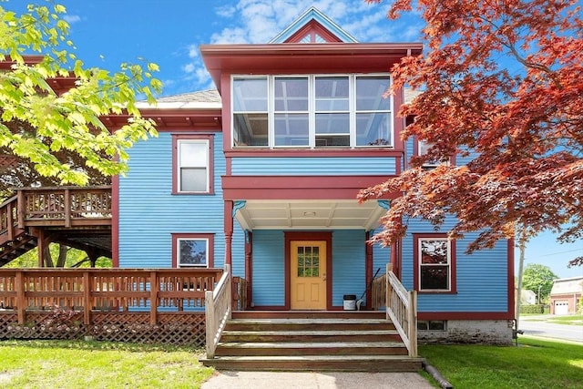 128 7th St, Montague, MA 01376 - view of front of house with a front lawn and a wooden deck