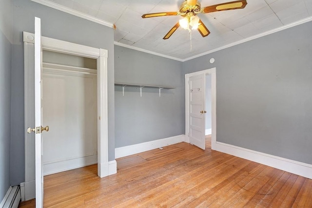 128 7th St, Montague, MA 01376 - unfurnished bedroom with baseboard heating, light wood-type flooring, baseboards, ornamental molding, and a ceiling fan
