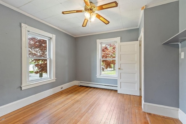 128 7th St, Montague, MA 01376 - unfurnished room featuring a baseboard heating unit, light wood-type flooring, crown molding, baseboards, and a ceiling fan