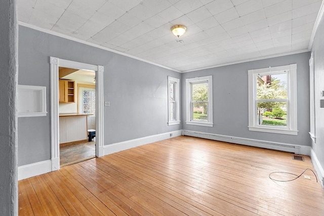 128 7th St, Montague, MA 01376 - unfurnished room with a baseboard radiator, hardwood / wood-style floors, crown molding, and baseboards
