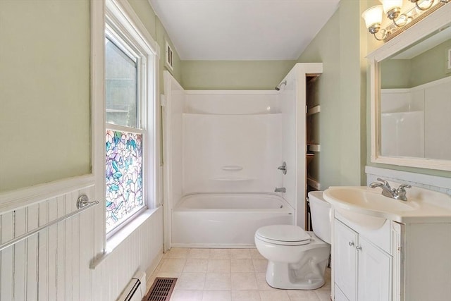 128 7th St, Montague, MA 01376 - bathroom featuring toilet, vanity,  shower combination, and tile patterned flooring